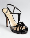 These ultra-slick kate spade new york sandals are going places in the glossiest patent leather and a strappy silhouette.