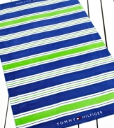 Lime green and blue stripes make a bold statement in this Cabana stripe beach towel, perfect for a relaxing day at the beach. Finished with the Tommy Hilfiger logo at each end.