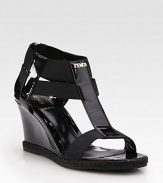 Glassy patent leather wedge enriched by rope trim, comfortable elastic straps and a goldtone nameplate. Patent leather and rope wedge, 3 (75mm)Patent leather and elastic upperLeather liningRubber solePadded insoleMade in ItalyOUR FIT MODEL RECOMMENDS ordering true size. 