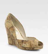 Snake-embossed metallic leather wedge with a low-cut front and subtle peep toe. Self-covered wedge, 5 (125mm)Covered platform, ½ (15mm)Compares to a 4½ heel (115mm)Snake-embossed metallic leather upperLeather liningBuffed leather solePadded insoleImported