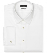 Classic fit, long sleeve tuxedo dress shirt. Luxe cotton shirt with spread collar and French cuffs. Clean front, no pockets.