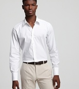 An ultraclean look. Cotton button-front shirt has spread collar, no pockets and a slightly lean fit.