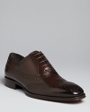 A classic To Boot wingtip in rich Italian leather always makes a strong impression.