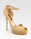 Bamboo-inspired heel adds a dose of exotic to this textured raffia and leather confection. Bamboo-print heel, 5 (125mm)Covered platform, 1 (25mm)Compares to a 4 heel (100mm)Raffia and leather upperLeather lining and solePadded insoleMade in ItalyOUR FIT MODEL RECOMMENDS ordering true size. 