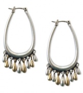 Add a little flair to your hoop earrings with this pair from Lucky Brand. Stunning accents crafted from gold- and silver-tone mixed metal dangle from the silver-tone hoops. Approximate drop: 1-7/8 inches.