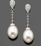 Swinging style you'll always love. These beautiful drop earrings feature cultured freshwater pearls (7.5-8 mm) and diamond accents set in 14k white gold. Approximate drop: 1-1/4 inches.