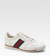 Lace-up sneaker with signature web and Gucci label on the tongue. Rubber sole Made in Italy Please note: For best fit please size down one full size.