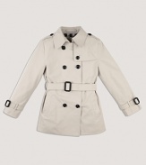 A classic double breasted trench coat with a belted waist for a sophisticated look.