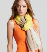 Echo's woven scarf captures this season's color block craze. Use it to boost the mood of monochromatic and basic black ensembles.