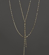 This twisted, glittering gold chain is perfect for adding delicate drama to any look. From Lana.