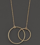 Two golden hoops punctuate a 14K gold chain.