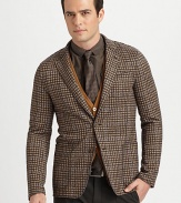 Handsomely constructed in a checked wool and cotton blend with a notched lapel and a single-breasted button front, finished in a modern, tailored fit.Button-frontChest welt, waist patch pocketsAbout 29 from shoulder to hem50% wool/43% cotton/7% polyesterDry cleanImported