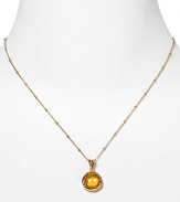 This haute bohemian pendant necklace from Coralia Leets charms with rich texture and hue. The gleaming gold setting sets off a citrine stone.