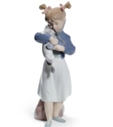 A young doctor prescribes lots of love and tummy rubs for her kitty in this adorable Lladro collectible, crafted of beautifully glazed porcelain.