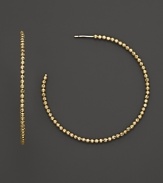 14K. yellow gold beads add fascinating texture and brilliance to classic hoops. By Lana.