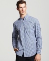 Tried-and-true gingham is made modern with a sophisticated button down shirt from Lacoste.