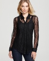 Top off your favorite pair of jeans with this sheer lace GUESS top.