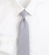 Narrow stripes lend an elegant appeal to this beautifully woven Italian silk tie. About 3 wideSilkDry cleanMade in Italy