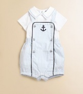 Set sail for this charming two-piece set with nautical embroidery and colorful stripes. Overall SquareneckSleevelessShoulder buttonsElastic waistbandBottom snaps for easy on and off Bodysuit Embroidered, pointed collarShort sleevesBack snapsBottom snapsCottonMachine washImported Please note: Numbers of buttons and snaps may vary depending on size ordered. 