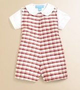 Crafted in luxurious silk, this dainty plaid shortall set dresses up baby in a snap.Overall CrewneckSleeveless with shoulder buttonsBottom snaps for easy on and offShirt Peter Pan collarShort sleevesFront buttonsSilkDry cleanImported Please note: Number of snaps may vary depending on size ordered. 