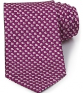 A luxurious piece that lies at the center of your dress wardrobe, this handsome tie from Salvatore Ferragamo is crafted in 100% Italian silk.