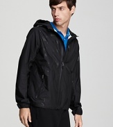 Burberry's lightweight nylon hooded jacket with zip front, Burberry Sport logo along the right side, two front zip pockets and a zip chest pocket .