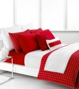 In a spicy palette of white and red, this Denab duvet cover set from Lacoste features a simple windowpane plaid print for a decidedly bold statement in the bedroom. Button closure.