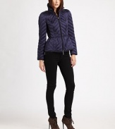 This sporty, quilted puffer style features a slightly flared peplum and crisp contrast piping.Stand collarEpaulettesZip frontContrast pipingContrast side panelsBack button tabsFully linedAbout 23 from shoulder to hemPolyesterImportedModel shown is 5'10 (177cm) wearing US size Small. 