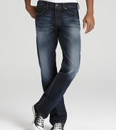 A relaxed fit jean with a deep blue rinse and contrast sandblast fading along the leg and seat.