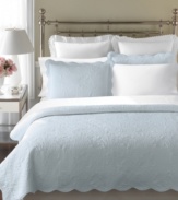 The Stenciled Leaves quilt from Martha Stewart Collection features bushels of leaves embossed over a light blue ground. Scalloped edges add a sense of elegance to this design in affordable cotton voile.