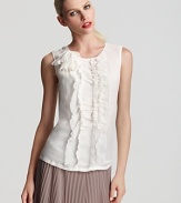 Lush ruffles adorn the front of this silk Escada top, an ultra-feminine addition to your trans-seasonal wardrobe. Gorgeous with a ladylike pleated skirt, the versatile silhouette is equally chic underneath a tailored suit.