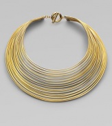 Totally simple and totally fabulous, this striking collar is gracefully formed of delicate brass wires with a polished finish.BrassLength, about 16Drop, about 8Toggle closeImported