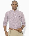 A polished bengal stripe motif adds timeless style to a trim-fitting sport shirt in crisp cotton poplin.