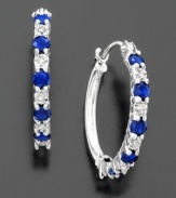 The perfect expression of elegance. Alternating round-cut sapphires (9/10 ct. t.w.) and diamond accents on 14k white gold hoop earrings. Diameter measures approximately 3/4 inch.