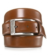 Sleek, brown dress belt with silvertone, brushed buckle. Hugo Boss engraved on buckle.