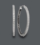 Let your style shine from the inside out! These exotic hoops feature a unique design with black diamond accents on the inside and white diamond accents on the outside. Crafted in 14k white gold. Approximate diameter: 1-1/4 inches.