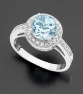 The icy dazzle of an round-cut aquamarine (1-3/8 ct. t.w.) is an ingenious complement to sparkling, full-cut diamonds (1/3 ct. t.w.). Set in 14k white gold.