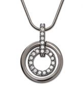 This classic pendant adds a touch of chic, modern style to any outfit. The dark sheen of the ruthenium tone mixed metal outer ring offsets the glitter of the inner circle with its clear Swarovski crystals set in pavé. Swarovski's Circle Pendant comes on a matching snake chain. Approximate length: 15 inches. Approximate drop: 7/8 inch.