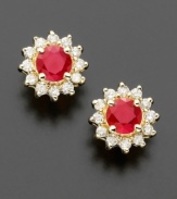 Royalty-inspired rubies. These petite floral-shaped earrings feature round-cut rubies (5/8 ct. t.w.) surrounded with sparkling round-cut diamond petals (1/4 ct. t.w.). Earrings crafted in 14k gold. Approximate diameter: 1/4 inch.