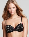 A lightly lined demi bra in a tattoo print for a tough girl look.