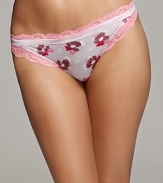 A floral print bikini bottom with floral lace detail at hips and waist for the perfect accent.