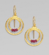 From the Glow Collection. Double hoops of 24K gold with triple ruby accents at the center.Ruby 24K yellow gold Length, about 1 Width, about ½ Ear hooks Imported 