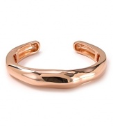 Alexis Bittar's rose gold-plated cuff is a striking example of the label's contemporary edge. With modernism a key trend, this bracelet lends every look a sculptural air.