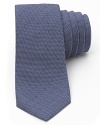 A quintessential tie with a classically understated pattern from Theory finishes your look with refined aplomb.