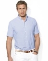 The embodiment of preppy heritage, a classic-fitting shirt is rendered in light-as-air seersucker cotton with sleek stripes for a casual warm-weather look.