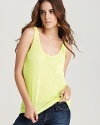 Shed some light on the season's brightest theme--neon--with this sheer Aqua tank. A bold way to highlight your sleekest jeans, this look travels into the night when you swap your flats for some killer stilettos.