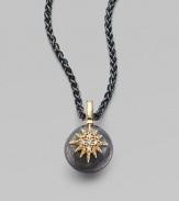 An oxidized silver ball, emboldened with a diamond-clad 14k yellow gold starburst, hangs from an oxidized silver chain.Diamonds, .05 tcw 14k yellow gold Oxidized sterling silver Length, about 17 Pendant diameter, about ½ Lobster clasp Made in USA