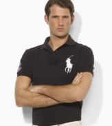 Cut for a trim, modern fit from breathable cotton mesh, this iconic short-sleeved polo shirt is designed exclusively for Ralph Lauren's collection celebrating the Wimbledon Championships.