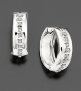 Diamond accents are set within wide, gleaming hoops of 14k white gold.