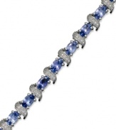 Enhance your look with an element of shine. This stunning sterling silver bracelet showcases oval-cut tanzanite (5-3/4 ct. t.w.) and shimmering diamond accents. Approximate length: 7-1/2 inches.